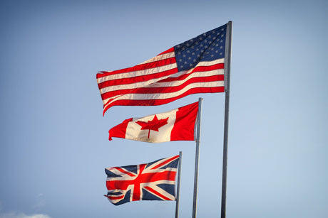 The US flag with the Canadian and UK flag