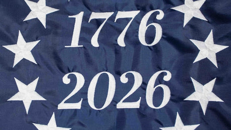 Betsy Ross flag with America 250 semiquincentennial text on a patriotic blue background with white stars