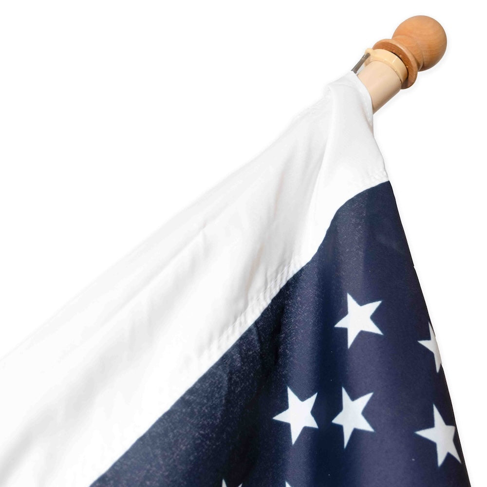 Wooden pole with American flag star field with pole sleeve heading