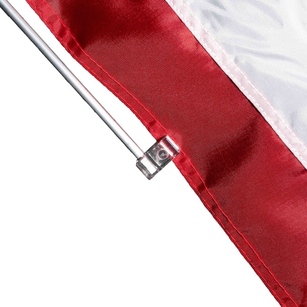A flag stabilizer rod connected to a flag set